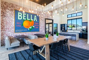 a conference room with a table and chairs and a poster on the wall